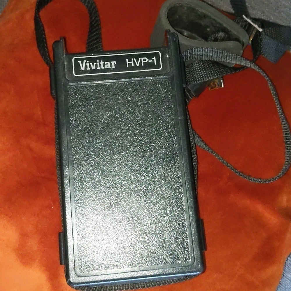 Vivitar HVP-1 battery pack with strap